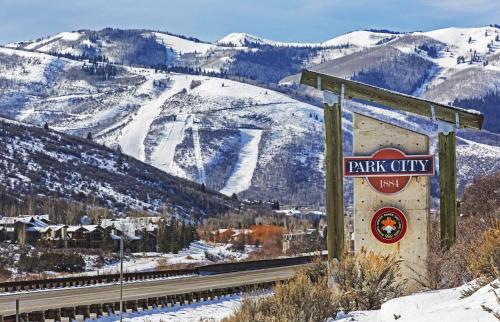 a sign for a park city with a snow covered mountain at Retreat at Jordanelle 1157 in Kamas