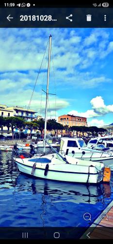 a group of boats are docked in a harbor at STELLA MARIS GAETA in Gaeta