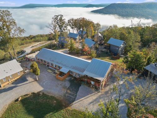 an overhead view of a house with a blue roof at The Yurt at Paradise Pointe with a hot tub fire pit & Grill in Bryant