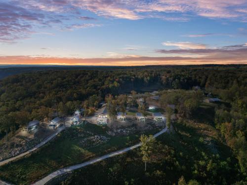 an aerial view of a home in the woods at TeePee at Paradise Point with a hot tub fire pit & grill in Bryant