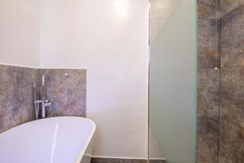 a bathroom with a toilet and a glass shower at La Casa di Fabiola in Bracciano