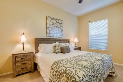 a bedroom with a bed and two lamps and a window at Mountain View #11107 Surprise in Surprise