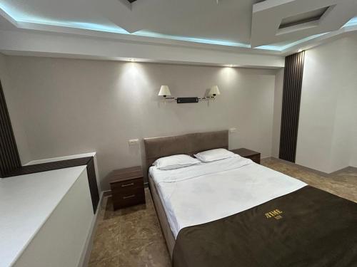 a bedroom with a large bed in a room at Grand time hotel in Yerevan