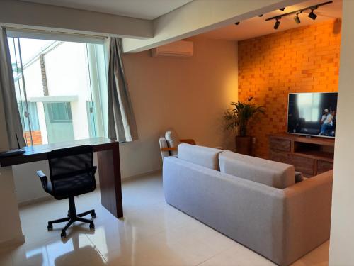 TV a/nebo společenská místnost v ubytování Apartamento com ar-condicionado, Wi-Fi no Campeche e estacionamento gratuito