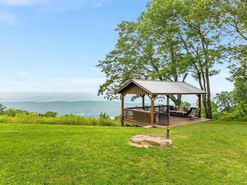 a wooden gazebo in a field of grass at Cragsmere Manor - Luxury Estate & Event Space in Mentone