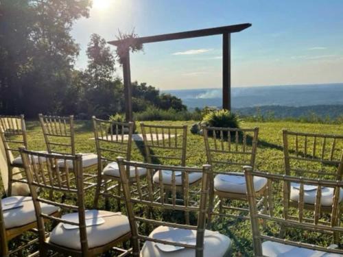 a set of chairs and a table with a view at Cragsmere Manor - Luxury Estate & Event Space in Mentone