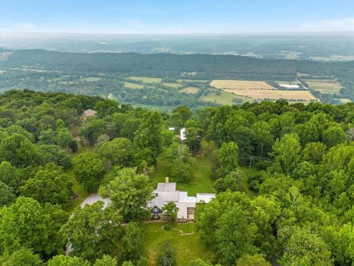 an aerial view of a white house in the trees at Cragsmere Manor - Luxury Estate & Event Space in Mentone
