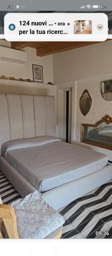 a bedroom with a large bed in a room at Orchidea in Beverino