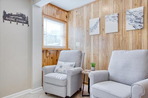 a waiting room with two chairs and a window at New River 3BR - Fishing, Hot Tub and VT Game Weekends in Radford