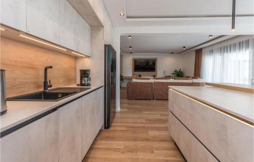 a kitchen with a sink and a counter top at Amazing Home In Kakma With Sauna in Kakma