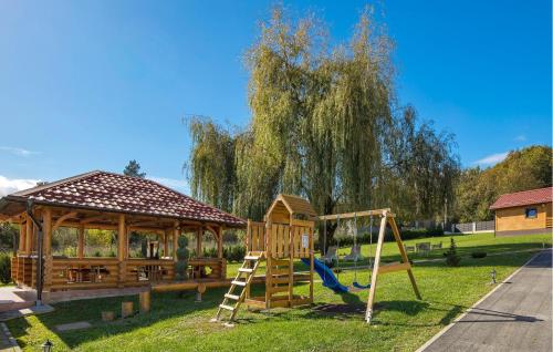 a playground with a slide and a gazebo at Amazing Home In Petrinja With Wi-Fi in Petrinja