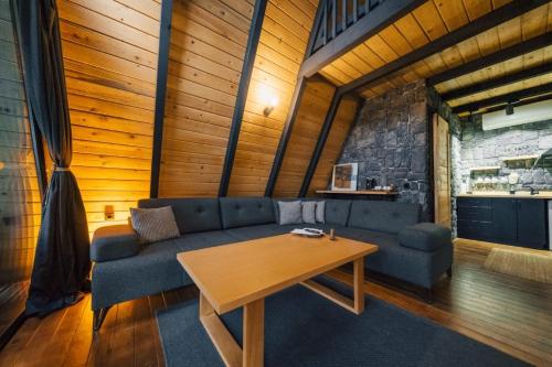 a living room with a couch and a table at MC Sapanca Hotel in Sakarya