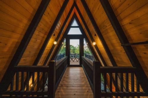 a wooden hallway with a large window in a cabin at MC Sapanca Hotel in Sakarya