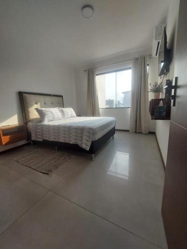 Llit o llits en una habitació de Confortable departamento
