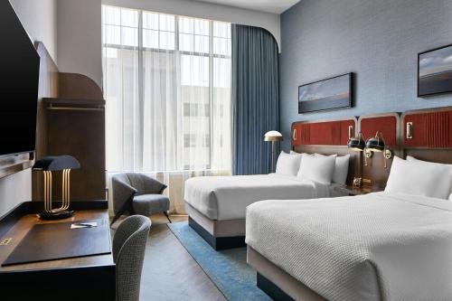Ένα ή περισσότερα κρεβάτια σε δωμάτιο στο The Olive Ann Hotel, Grand Forks, a Tribute Portfolio Hotel