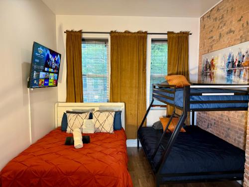 a bedroom with a bunk bed and a bunk bed at Hotel-Style, No Host, Professionally Managed ID289 in Jersey City