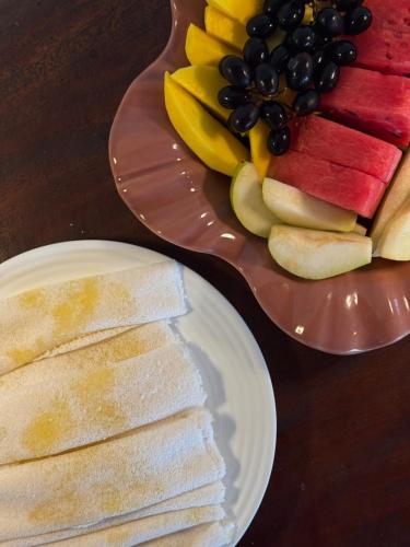 a plate of sliced fruit on a table at Choupanas Awa - All inclusive em Anavilhanas in Novo Airão