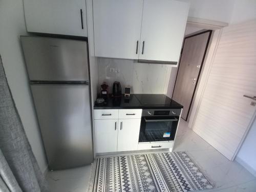 Η κουζίνα ή μικρή κουζίνα στο Lily's modern apartment downtown Skala