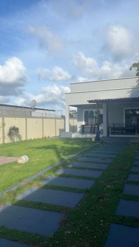 a walkway in front of a building at Casa Salinas in Salinópolis