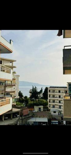 a view from a window of a city with buildings at Tranquility Apartment in Sarandë