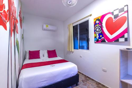 a small bedroom with a bed in a room at MINCA Chunuu - glamping - coworking MINCA in Minca