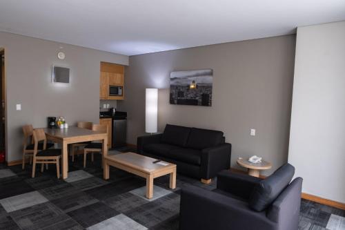 a living room with a couch and a table at Holiday Inn Express Mexico Reforma by IHG in Mexico City
