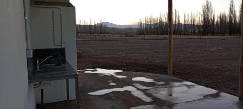 a kitchen with a view of a field at Cabañas Las Josefinas in Malargüe