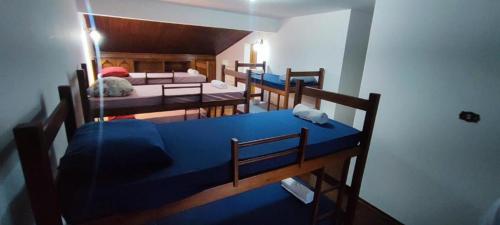 Postel nebo postele na pokoji v ubytování Suites Quartos Lindos Sobrado com Piscina no Centro