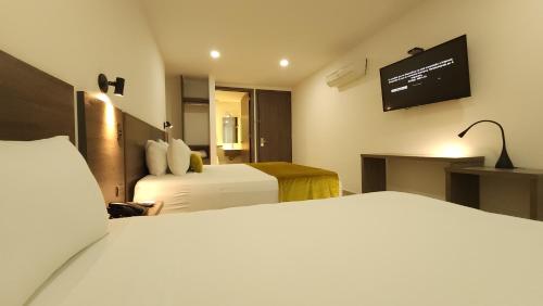 Una cama o camas en una habitación de BCA HOTEL
