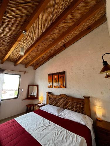 a bedroom with a large bed in a room at Finca del Valle in Valle de Bravo