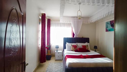 Postel nebo postele na pokoji v ubytování Bomani -3 Nati Apartment