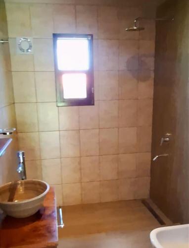 a bathroom with a sink and a shower at Barcena Houses in Tumbaya