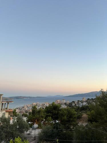 una vista de una ciudad con el océano en el fondo en M&A Apartment II, en Sarandë