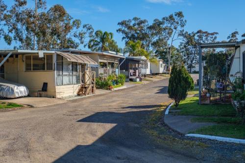 a row of houses on the side of a road at Tamworth Holiday Park in Tamworth