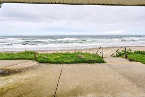 a view of a beach with the ocean at Beachfront Studio - No Stairs - Patio - Full Kitchen in Lincoln City