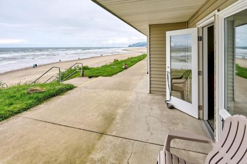 a porch of a house with a view of the beach at Beachfront Studio - No Stairs - Patio - Full Kitchen in Lincoln City