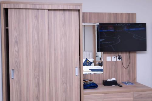 Televisyen dan/atau pusat hiburan di فندق نجمة مارينا Marina Star Hotel