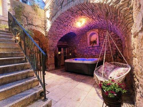 a room with a bed in a brick wall at Holiday house with a parking space Blato, Korcula - 24736 in Blato