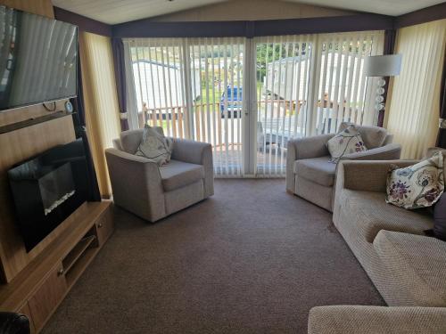 Χώρος καθιστικού στο The Elegant Escape Clarach Bay Pet Friendly 2 Bed Caravan