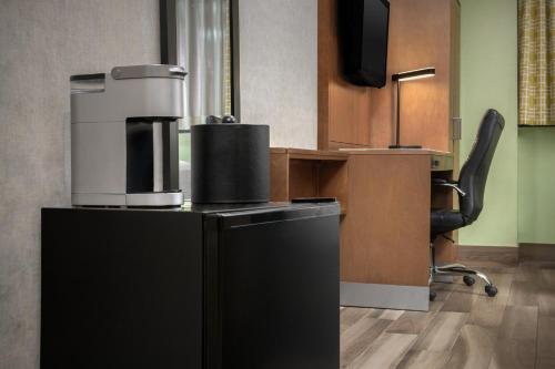 an office with a coffee machine and a desk at Holiday Inn Express Manhattan Midtown West by IHG in New York