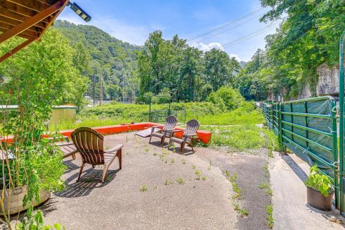 a group of chairs and a table in a yard at ATV Escape Near Hatfield-McCoy Trails in Matewan! 