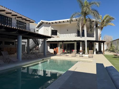 a house with a swimming pool in front of it at Luxury Casa Amaia with Private Pool in Cabo San Lucas