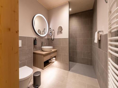 a bathroom with a sink and a mirror at Cottage in Tournai with Forest View in Antoing