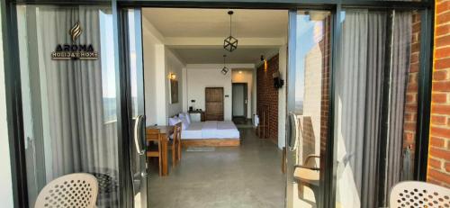 a view of a room with a bed and a bedroom at Aroma Holiday Home-Haputhale in Haputale