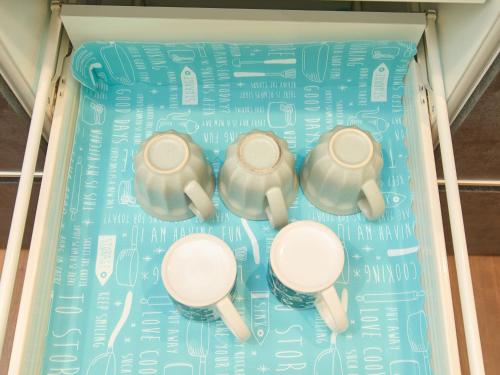 a display of four elephants on a blue background at ちょこっとヴィラMaestro in Tusi