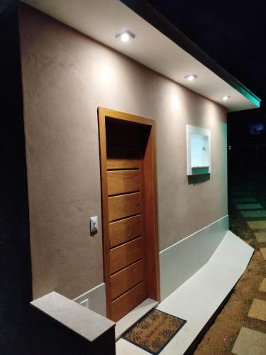 a room with a door in a wall at Flat Sognare Due in Santa Teresa