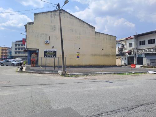 a large building on the side of a street at The Host Hotel in Ipoh