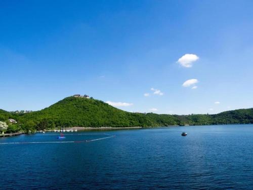 a large body of water with boats in it at Exclusives Ferienhaus in Frankenau im Sauerland in Frankenau