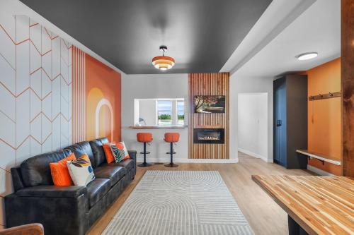 a living room with a couch and a table at On The Dock by Westlynn in Little Current