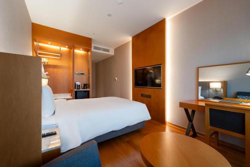 Postel nebo postele na pokoji v ubytování Hotel Interburgo Daegu